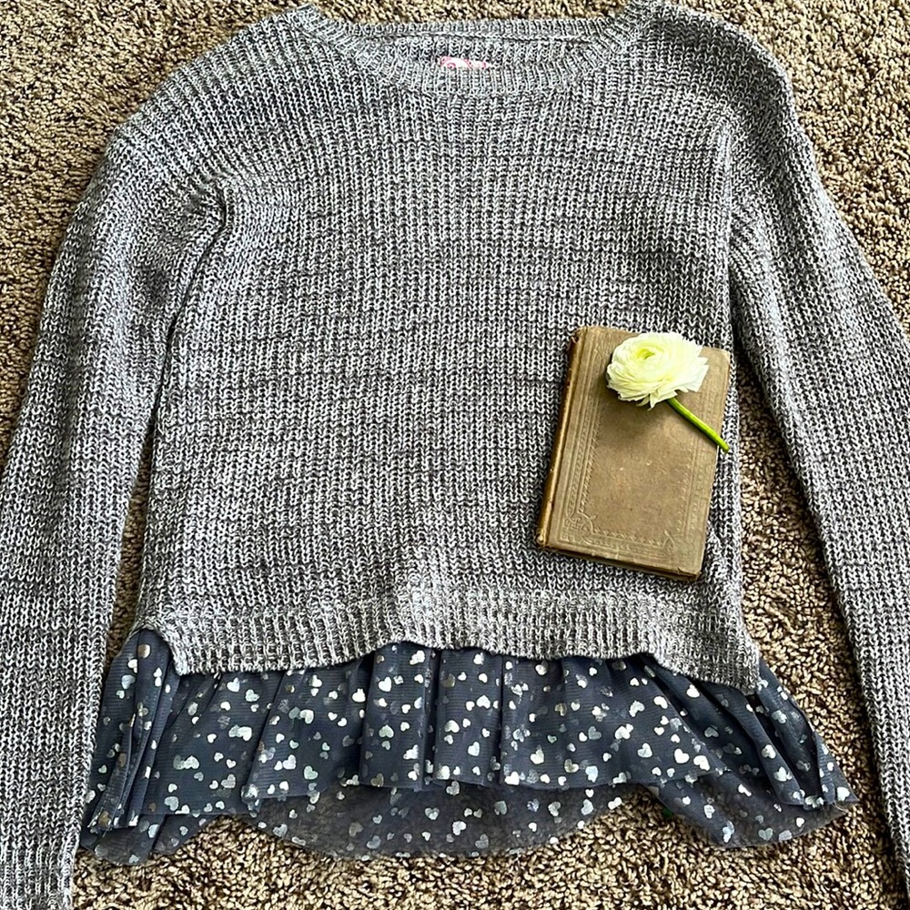 Sweater, brand is SO, it’s grey and dark grey